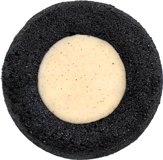 A single black and white cookie with vanilla cream filling in the center, featured on the homepage, viewed from the top on a transparent background.